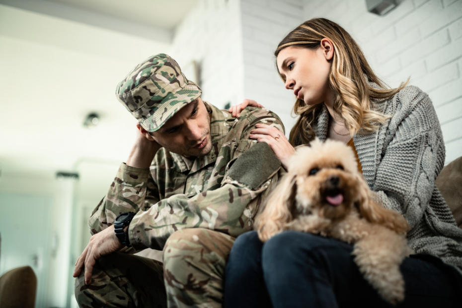 Photo of a military man with a stressed look being comforted by his wife and dog. Speaking with a relationship counselor who specializes in the struggles of military couples can be a great first step. Military spouse therapy can help you improve your relationships. And it can help you heal, reconnect, and thrive.
