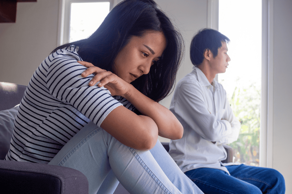 Photo of a couple upset after fighting with each other. This represents how infidelity can cause strain on your relationship. Marriage counseling for infidelity creates a safe space for you and your partner to approach the issues in the relationship and move forward.