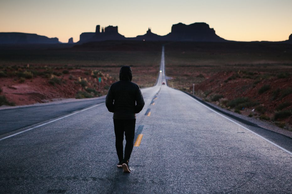 Photo of a person walking in a open road that goes to the horizont. The process of adapting to a new culture can be described by the four stages of culture shock. Being familiar with these stages can help you navigate culture shock more easily and empower you to seek the support that will help you to thrive in your new home.