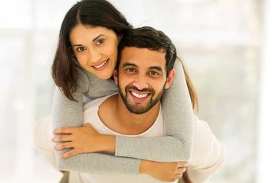 Photo of a couple hugging and feeling close to each other. This represents how the guidance and support from an experienced relationship therapist can help you and your partner work through your issues.