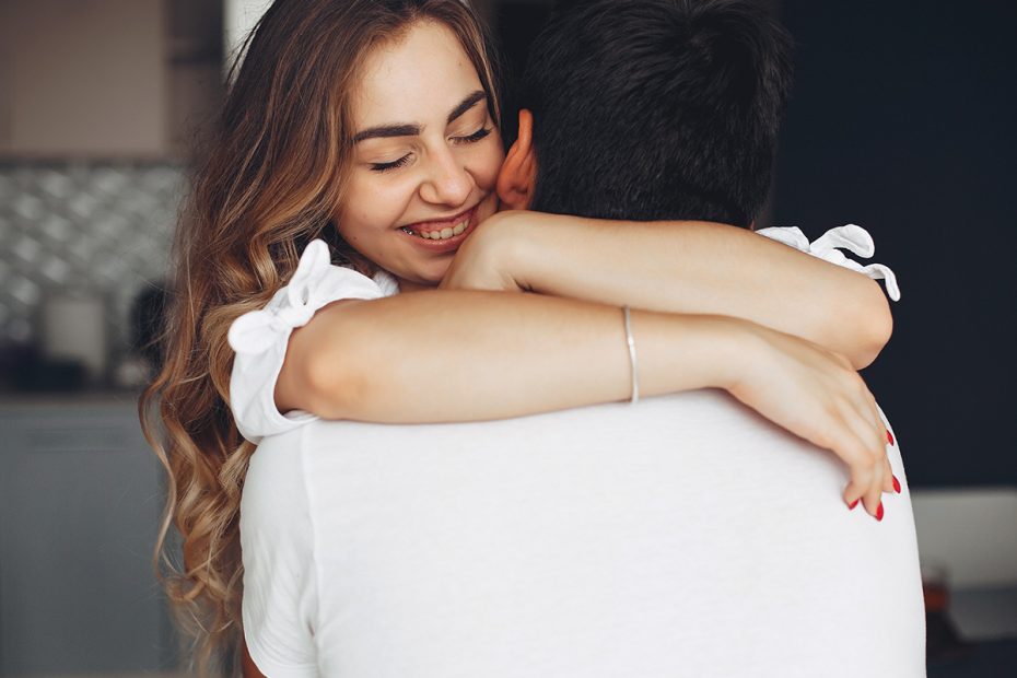 Photo of a couple hugging, feeling happy and connected to each other. This represents how Intensive Couples Therapy can help a highly effective way for couples to work through their issues and build a stronger relationship.