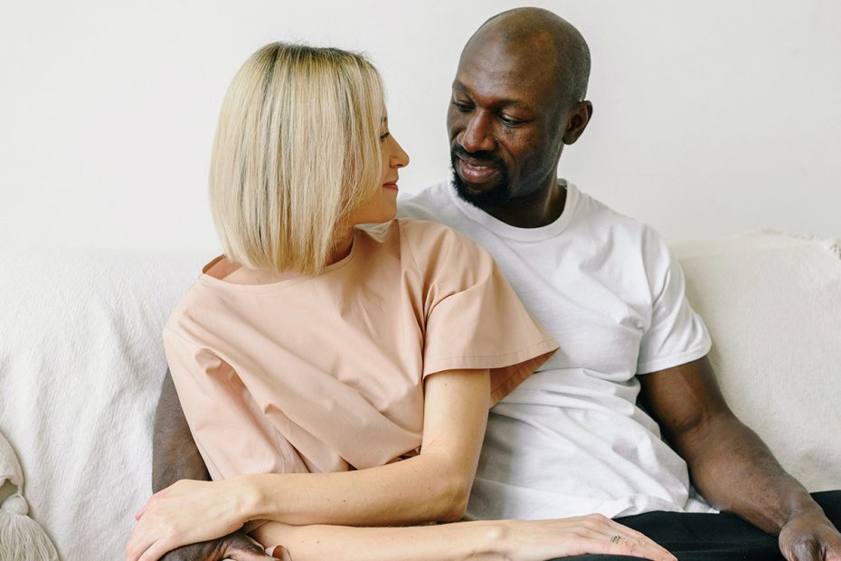 Photo of a multicultural couple, looking at each other with love and affection. This represents how Deep Connections Counseling can help you discover if marriage counseling works and how it can improve your relationship.